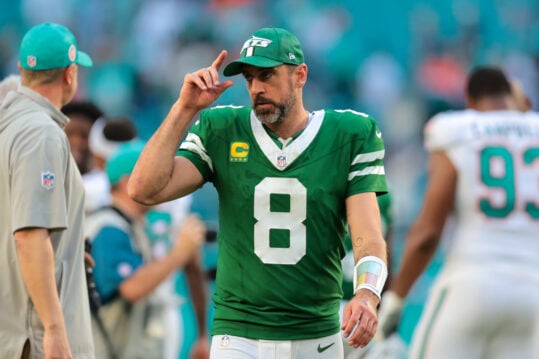 Dec 8, 2024; Miami Gardens, Florida, USA; New York Jets quarterback Aaron Rodgers (8) reacts from the field after the game against the Miami Dolphins at Hard Rock Stadium. Mandatory Credit: Sam Navarro-Imagn Images