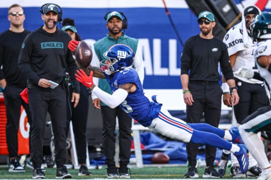 Oct 20, 2024; East Rutherford, New Jersey, USA; New York Giants wide receiver Jalin Hyatt (13) attempts to catch a pass in front of Philadelphia Eagles safety Tristin McCollum (36) during the second half at MetLife Stadium. Mandatory Credit: Vincent Carchietta-Imagn Images