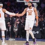 New York Knicks center Karl-Anthony Towns (32) is greeted by guard Josh Hart