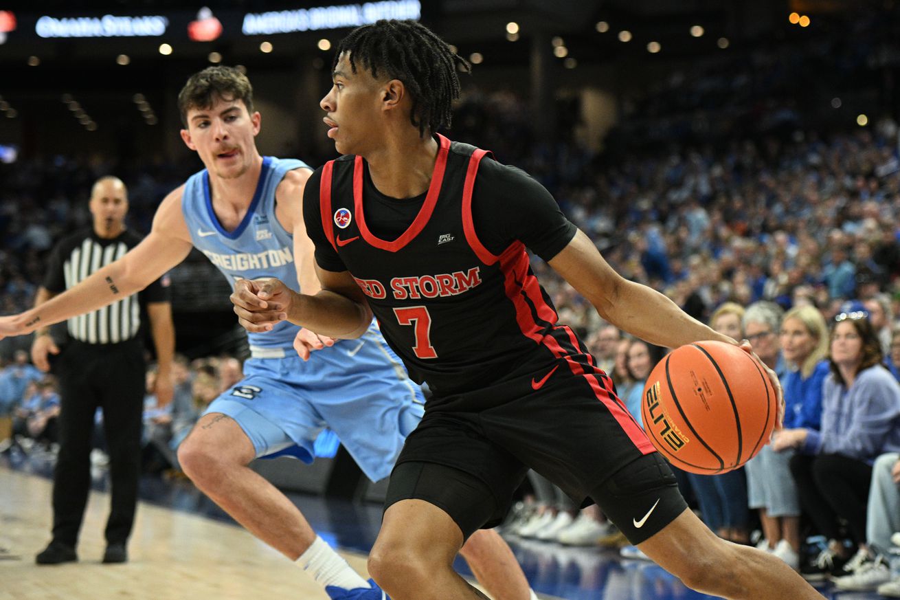 Dec 31, 2024; Omaha, Nebraska, USA; St. John’s Red Storm guard Simeon Wilcher (7) dribbles against Creighton Bluejays forward Mason Miller (13) during the first half at CHI Health Center Omaha. Mandatory Credit: Steven Branscombe-Imagn Images