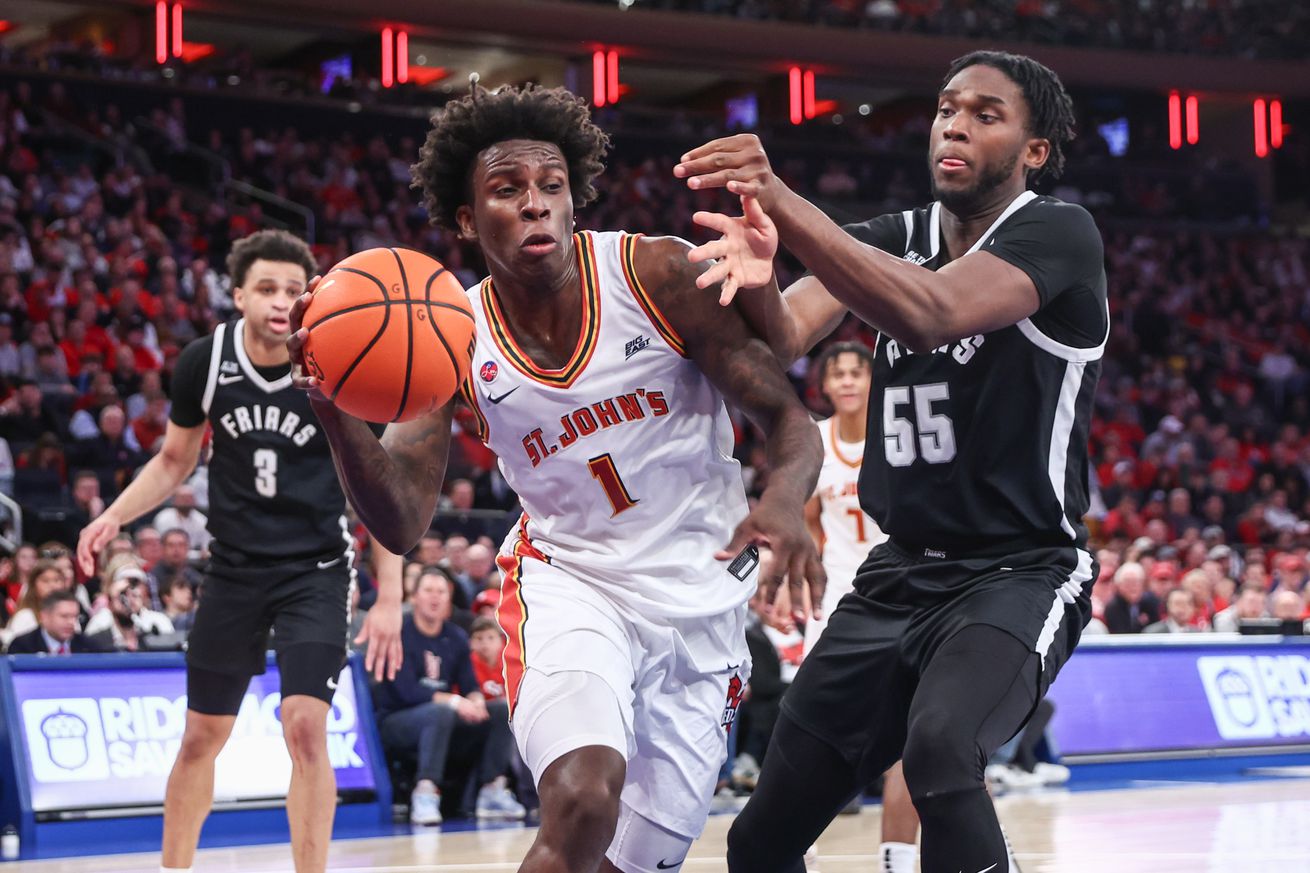 Feb 1, 2025; New York, New York, USA; St. John’s Red Storm guard Kadary Richmond (1) looks to drive past Providence Friars forward Oswin Erhunmwunse (55) in the second half at Madison Square Garden. Mandatory Credit: Wendell Cruz-Imagn Images