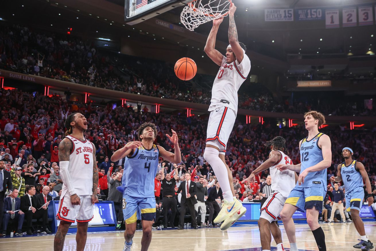 Feb 4, 2025; New York, New York, USA; St. John’s Red Storm guard Aaron Scott (0) dunks in the second half against the Marquette Golden Eagles at Madison Square Garden. Mandatory Credit: Wendell Cruz-Imagn Images