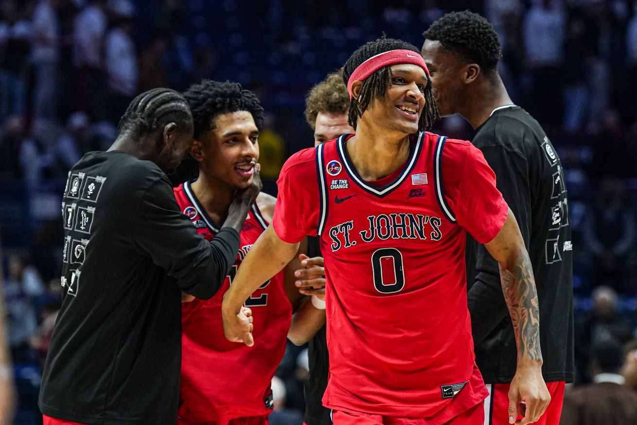 Feb 7, 2025; Storrs, Connecticut, USA;St. John’s Red Storm guard Aaron Scott (0) and guard RJ Luis Jr. (12) react after defeating the UConn Huskies in the second half at Harry A. Gampel Pavilion. Mandatory Credit: David Butler II-Imagn Images