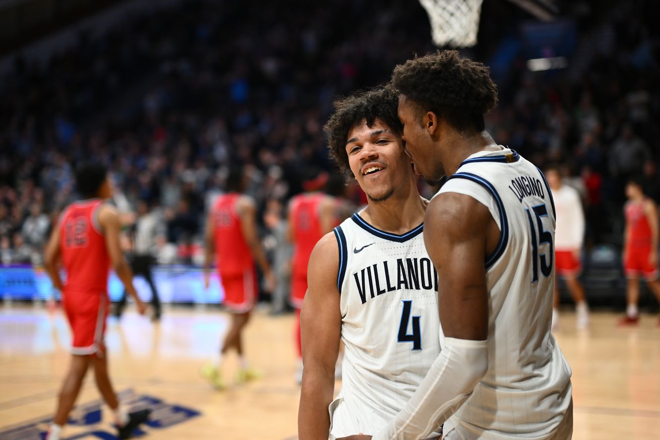 Feb 12, 2025; Villanova, Pennsylvania, USA; Villanova Wildcats guard Tyler Perkins (4) celebrates with guard Jordan Longino (15) after the game against Saint John’s Red Storm at William B. Finneran Pavilion. Mandatory Credit: Kyle Ross-Imagn Images