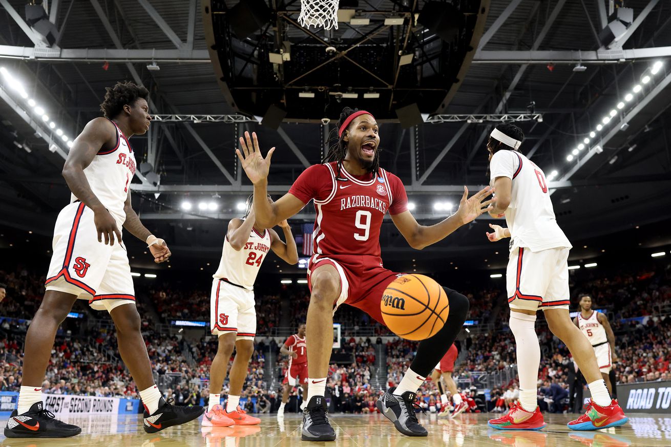 PROVIDENCE, RHODE ISLAND - MARCH 22: Jonas Aidoo #9 of the Arkansas Razorbacks celebrates a dunk against the St. John’s Red Storm during the second half in the second round of the NCAA Men’s Basketball Tournament at Amica Mutual Pavillion on March 22, 2025 in Providence, Rhode Island.