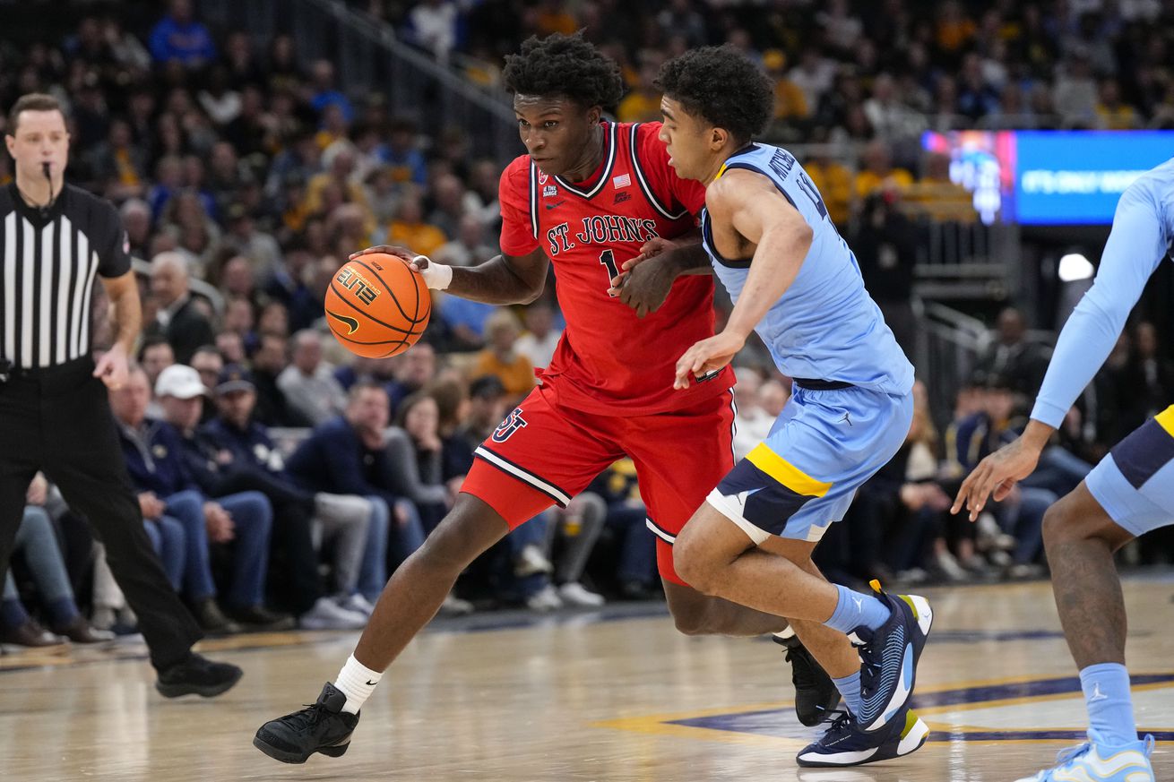 Mar 8, 2025; Milwaukee, Wisconsin, USA; St. John’s Red Storm guard Kadary Richmond (1) drives for the basket against Marquette Golden Eagles guard Stevie Mitchell (4) during the first half at Fiserv Forum. Mandatory Credit: Jeff Hanisch-Imagn Images