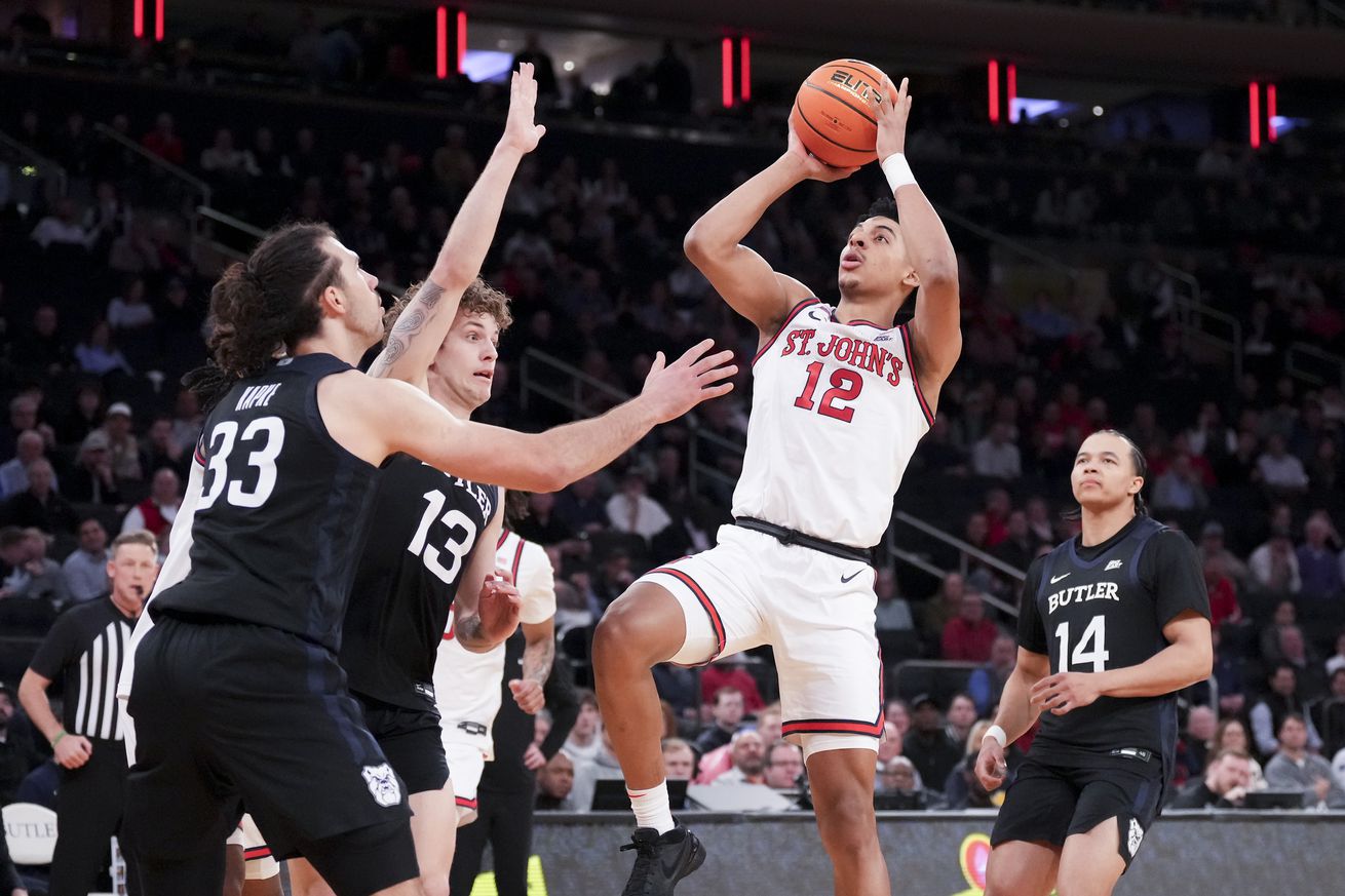 Mar 13, 2025; New York, NY, USA; St. John’s Red Storm guard RJ Luis Jr. (12) shoots past Butler Bulldogs during the first half at Madison Square Garden. Mandatory Credit: Robert Deutsch-Imagn Images