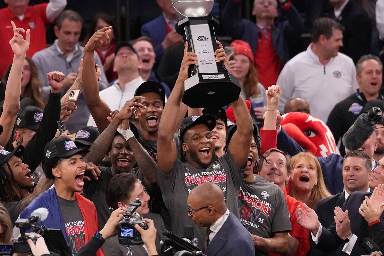 Mar 15, 2025; New York, NY, USA; St. John’s Red Storm forward Zuby Ejiofor (24) with the Big East trophy after winning the Big East Championship against the Creighton Bluejays at Madison Square Garden. Mandatory Credit: Robert Deutsch-Imagn Images