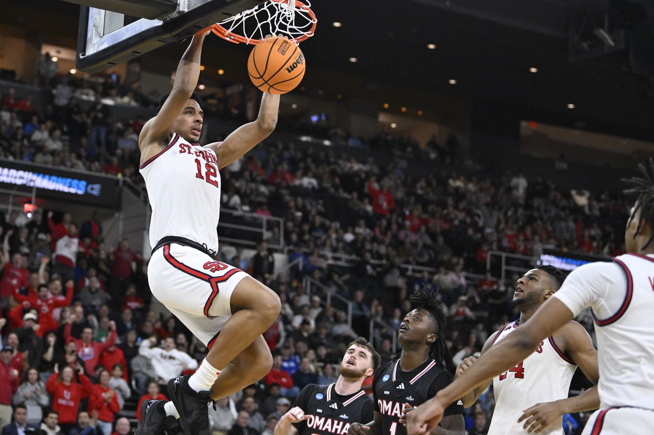 Mar 20, 2025; Providence, RI, USA; St. John’s Red Storm guard RJ Luis Jr. (12) puts up a basket during the second half against the Omaha Mavericks at Amica Mutual Pavilion. Mandatory Credit: Eric Canha-Imagn Images